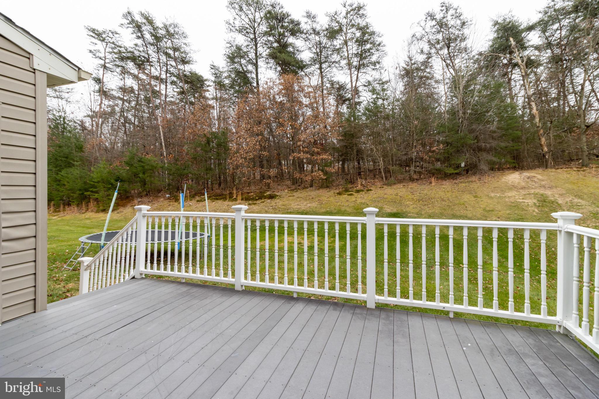 7751 Rotherham Drive Hanover, MD 21076 - Photo 39 of 42 Deck w/ Treelined Views