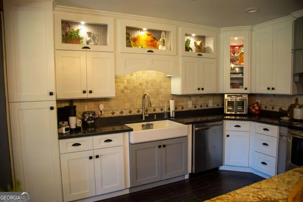a kitchen with cabinets and window
