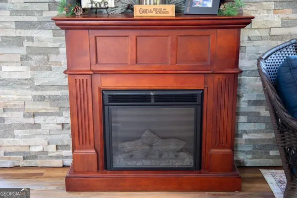 a view of fireplace and wooden floor