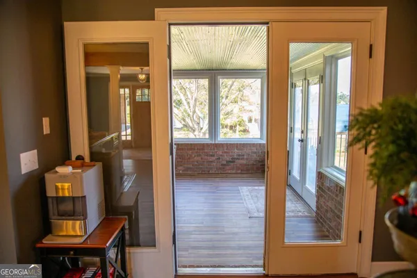 a view of a room that has a bed and a window