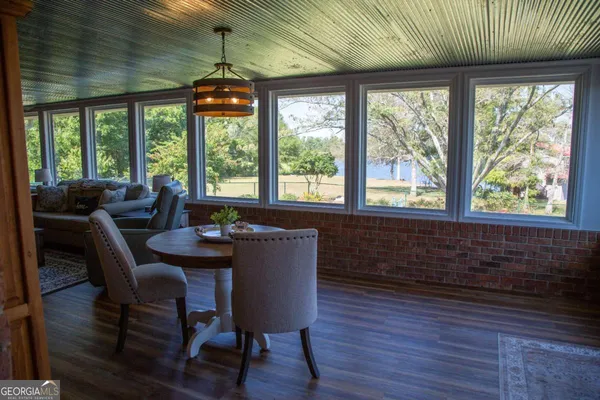 a dining room with furniture window wooden floor