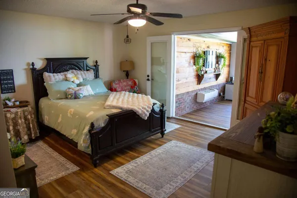 a bed sitting in a bedroom next to a window