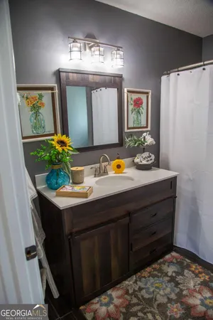 a bathroom with a sink and a mirror