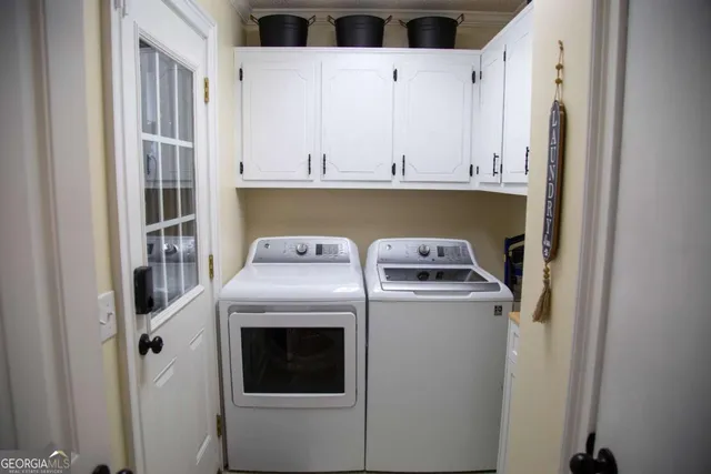 a view of a chairs and table in backyard