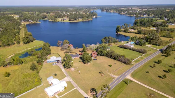 an aerial view of a house with a ocean view