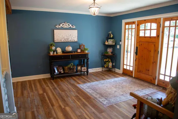 a bedroom with furniture and a window