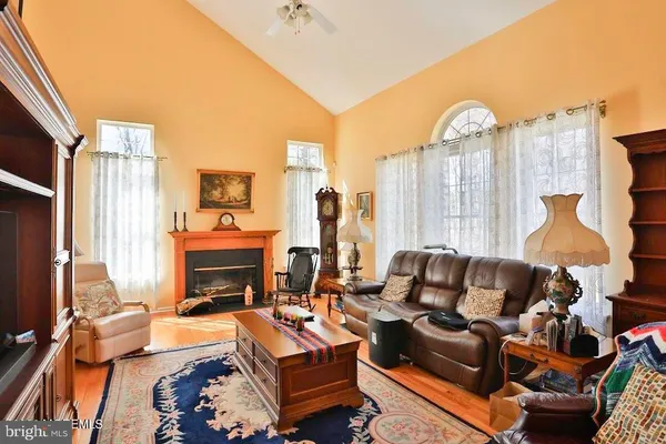 a living room with furniture fireplace and a flat screen tv