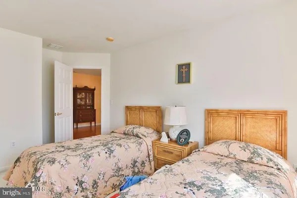 a bedroom with bed and a window