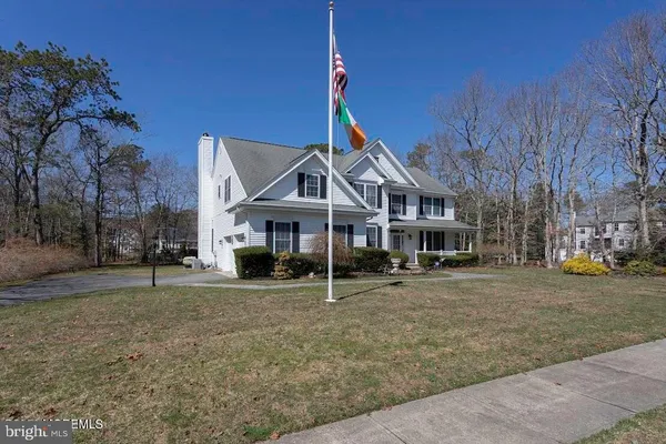a house with trees in front of it