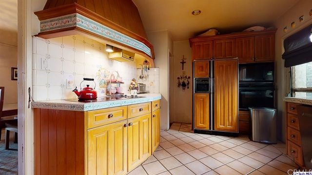 a view of a refrigerator and window