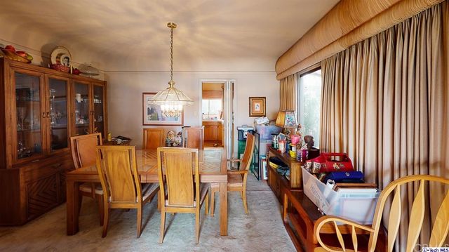 a view of a livingroom with furniture window and wooden floor