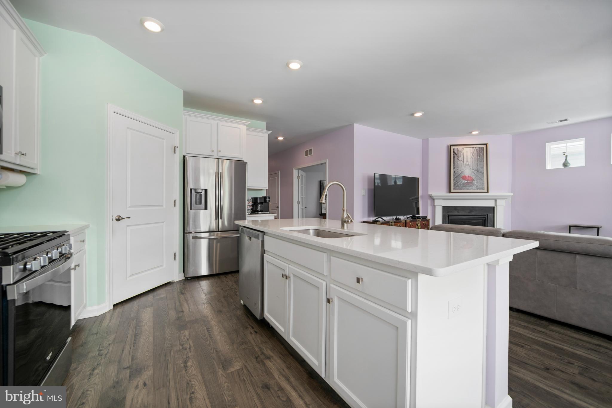 33 Walton Way Delanco, NJ 08075 - Photo 14 of 46 a kitchen with a sink a refrigerator and a stove top oven