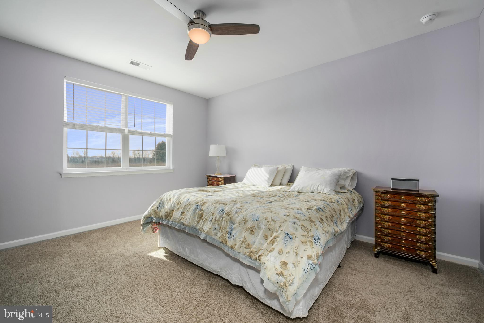 33 Walton Way Delanco, NJ 08075 - Photo 22 of 46 a bedroom with a bed a dresser and a window