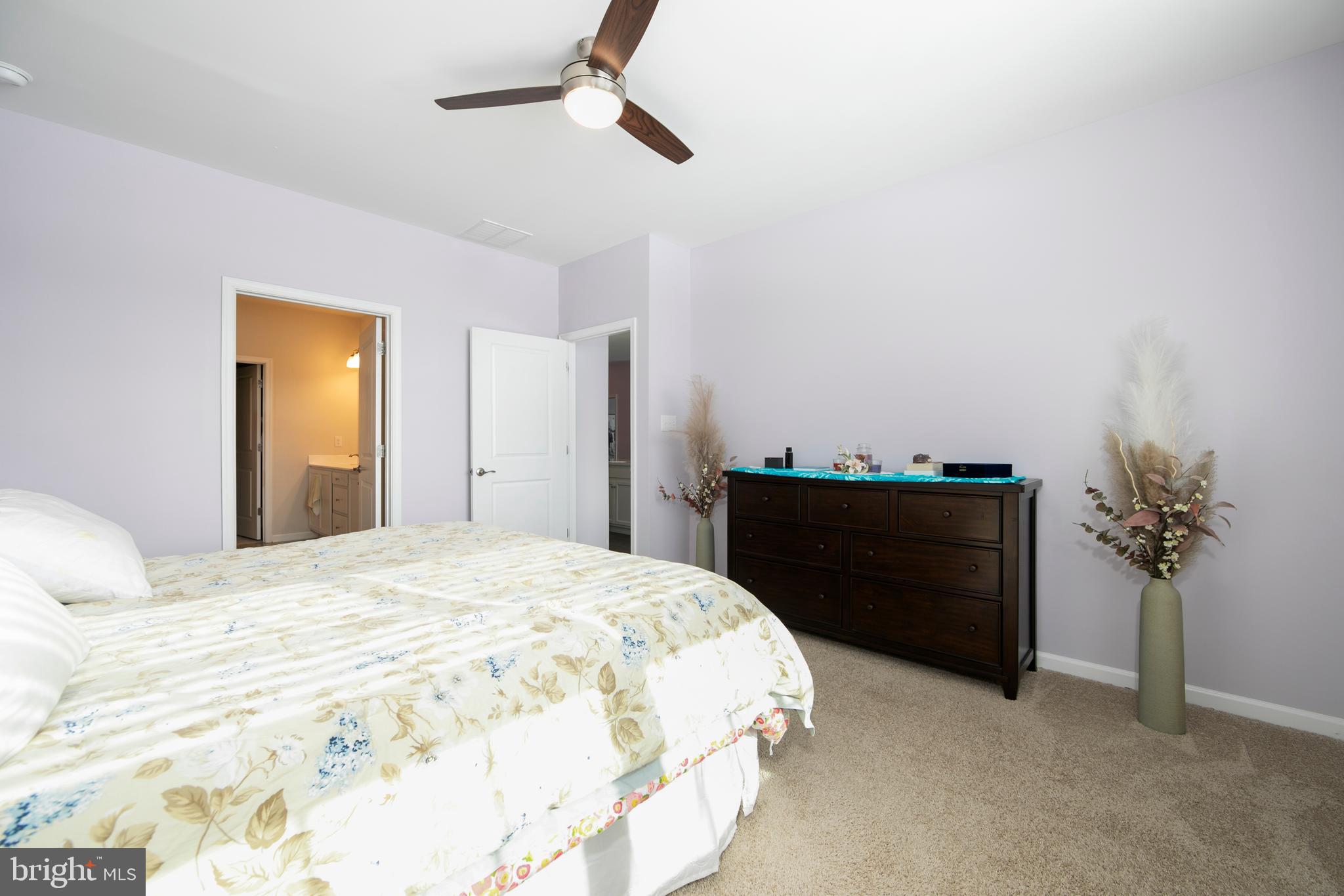 33 Walton Way Delanco, NJ 08075 - Photo 24 of 46 a bedroom with a bed and a potted plant
