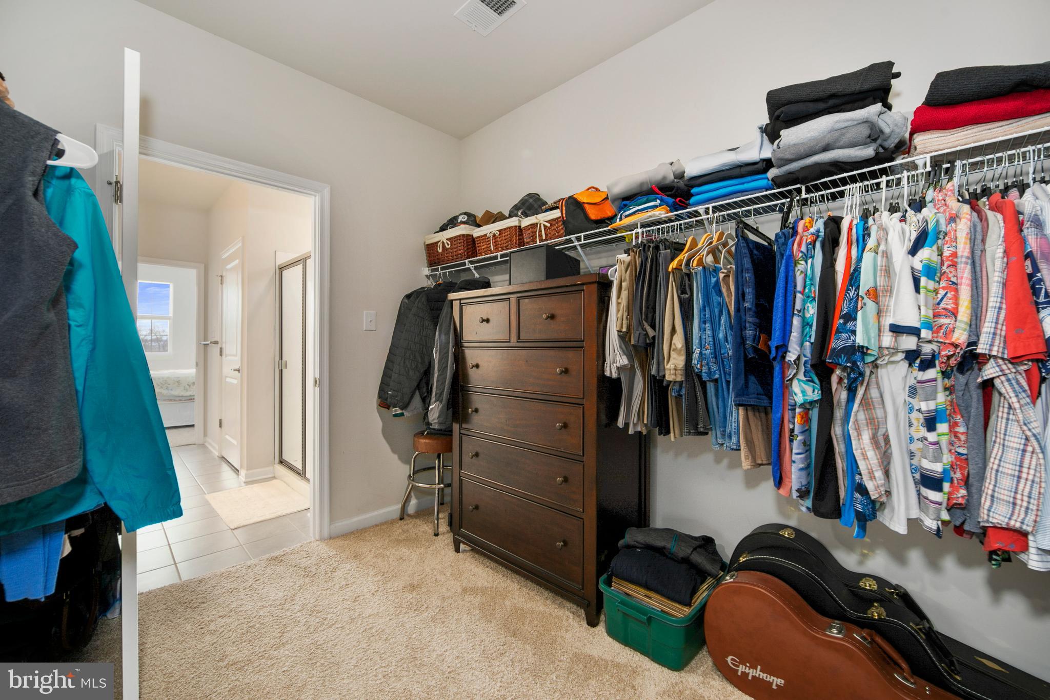 33 Walton Way Delanco, NJ 08075 - Photo 27 of 46 a view of walk in closet with clothes and shoes