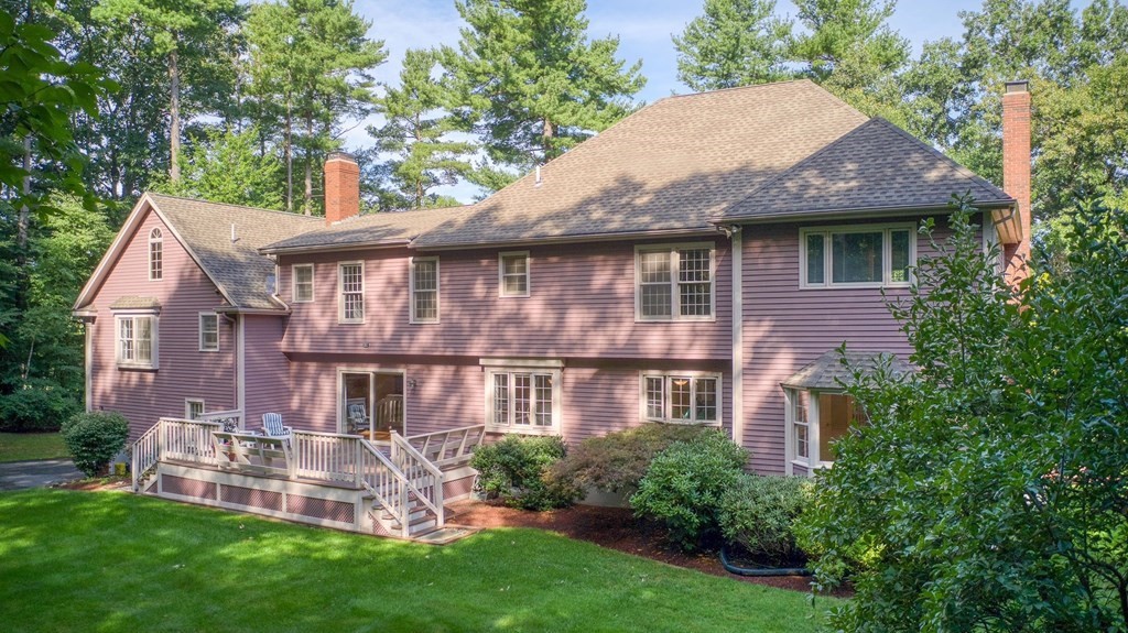 9 Hitchcock Farm Road Andover, MA 01810 - Photo 5 of 42 a front view of a house with a yard and green space