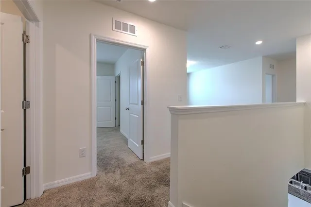 a view of a hallway with closet