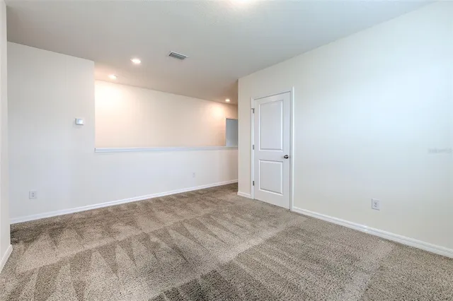 an empty room with an entryway