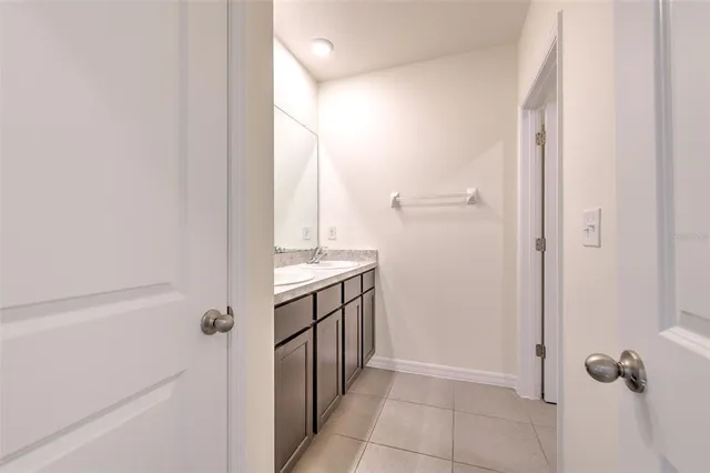 a bathroom with a sink a mirror and a shower