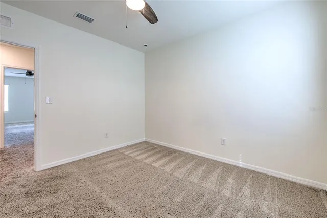 an empty room with a empty space and a window