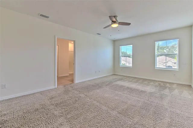 a view of an empty room with a window