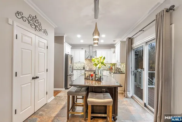 a open kitchen with a table and chairs