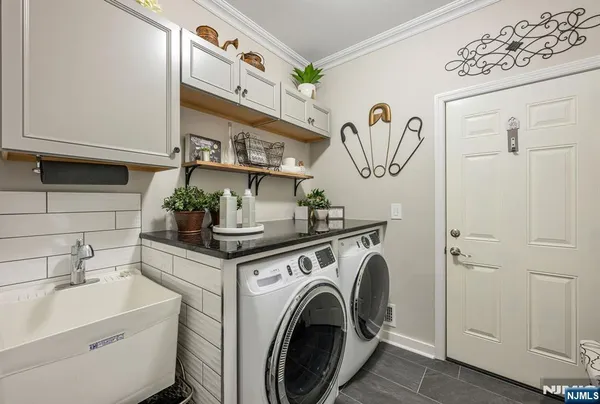 a view of a kitchen with sink and washing machine