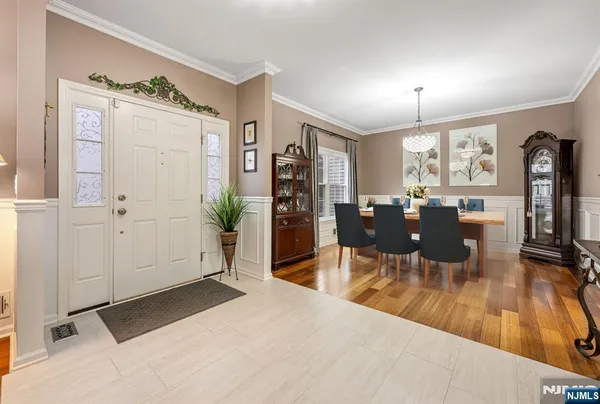 a living room with furniture window and wooden floor