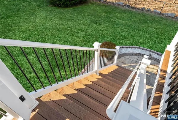 a view of a balcony with wooden floor