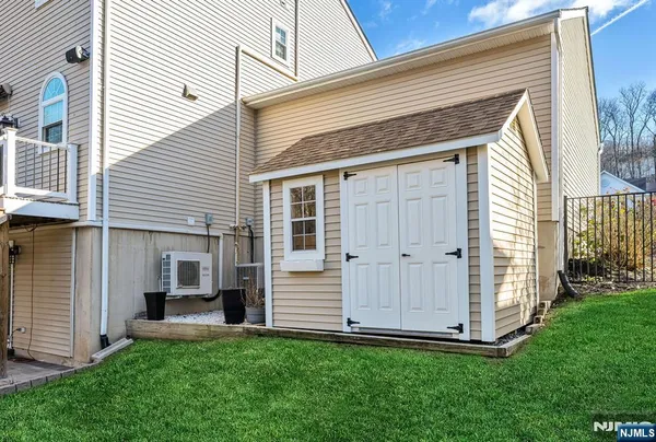 a view of backyard with a garden and entertaining space
