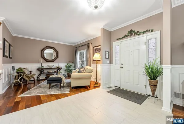 a living room with furniture potted plant and a window