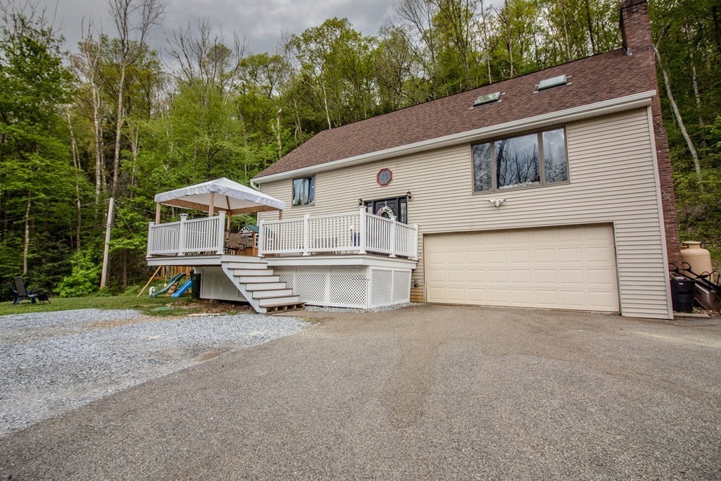 34 Union Road Holland, MA 01521 - Photo 1 of 29 a view of a house with a yard and garage
