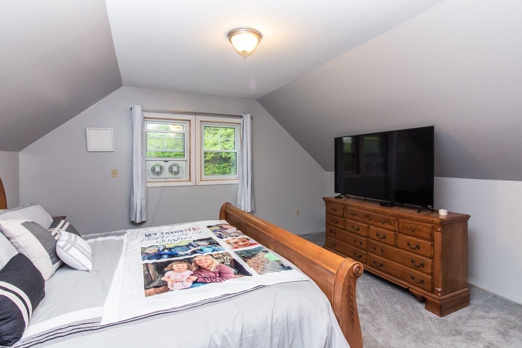 34 Union Road Holland, MA 01521 - Photo 11 of 29 a bedroom with a bed window and flat screen tv