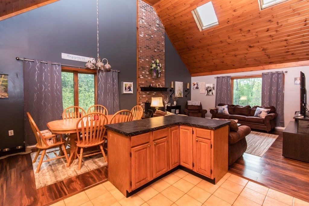34 Union Road Holland, MA 01521 - Photo 9 of 29 a kitchen with stainless steel appliances granite countertop sink microwave and wooden floor