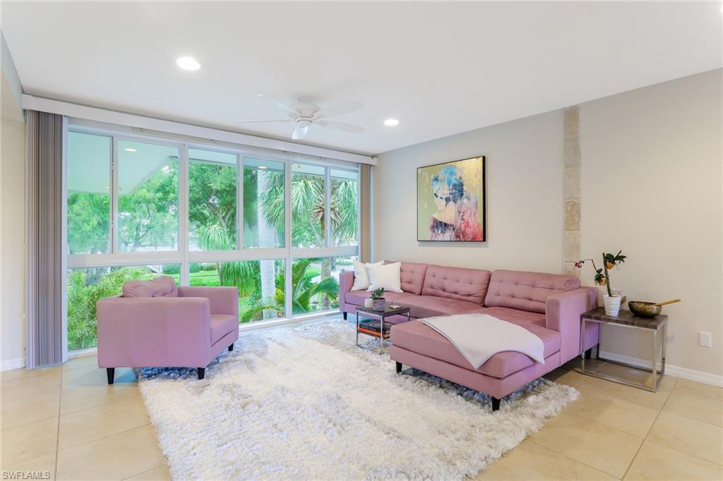 1340 Crayton Road, Unit 4 Naples, FL 34102 - Photo 1 of 20 a living room with furniture and a large window