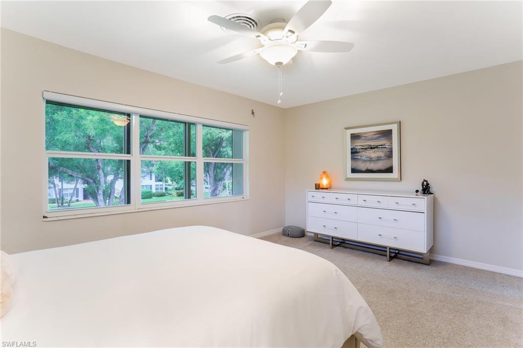 1340 Crayton Road, Unit 4 Naples, FL 34102 - Photo 12 of 20 a bedroom with a bed and a window