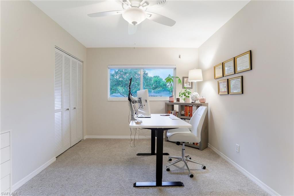 1340 Crayton Road, Unit 4 Naples, FL 34102 - Photo 15 of 20 a view of a workspace with furniture and a window