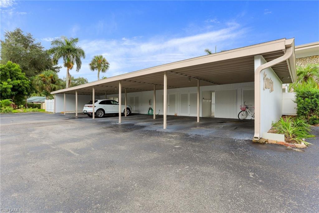 1340 Crayton Road, Unit 4 Naples, FL 34102 - Photo 17 of 20 a view of a car garage of the house