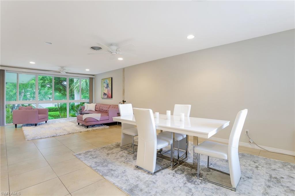 1340 Crayton Road, Unit 4 Naples, FL 34102 - Photo 3 of 20 a living room with furniture and a large window