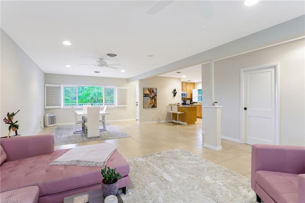 1340 Crayton Road, Unit 4 Naples, FL 34102 - Photo 5 of 20 a living room with furniture and a large window