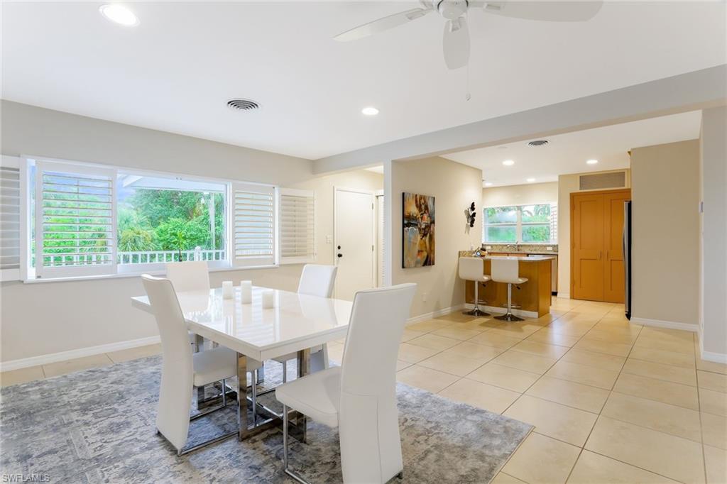 1340 Crayton Road, Unit 4 Naples, FL 34102 - Photo 6 of 20 a view of a dining room with furniture window and outside view
