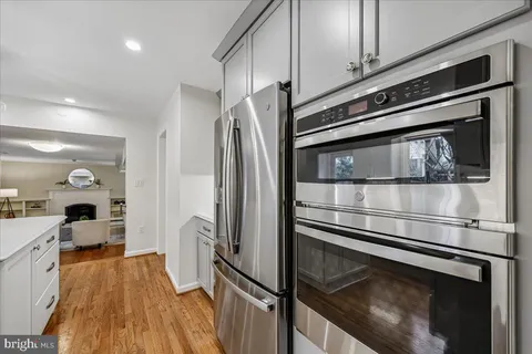 a kitchen with stainless steel appliances a stove and a refrigerator