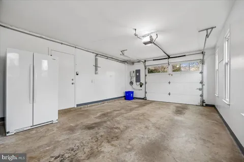 a view of a room with window and a ceiling fan