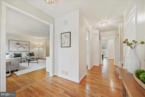a view of a livingroom with furniture and an entryway