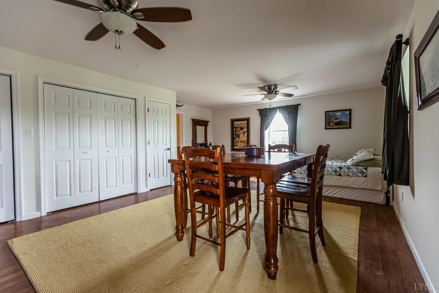 4037 County Line Road Cullen, VA 23934 - Photo 20 of 45 a view of a dining room with furniture and wooden floor