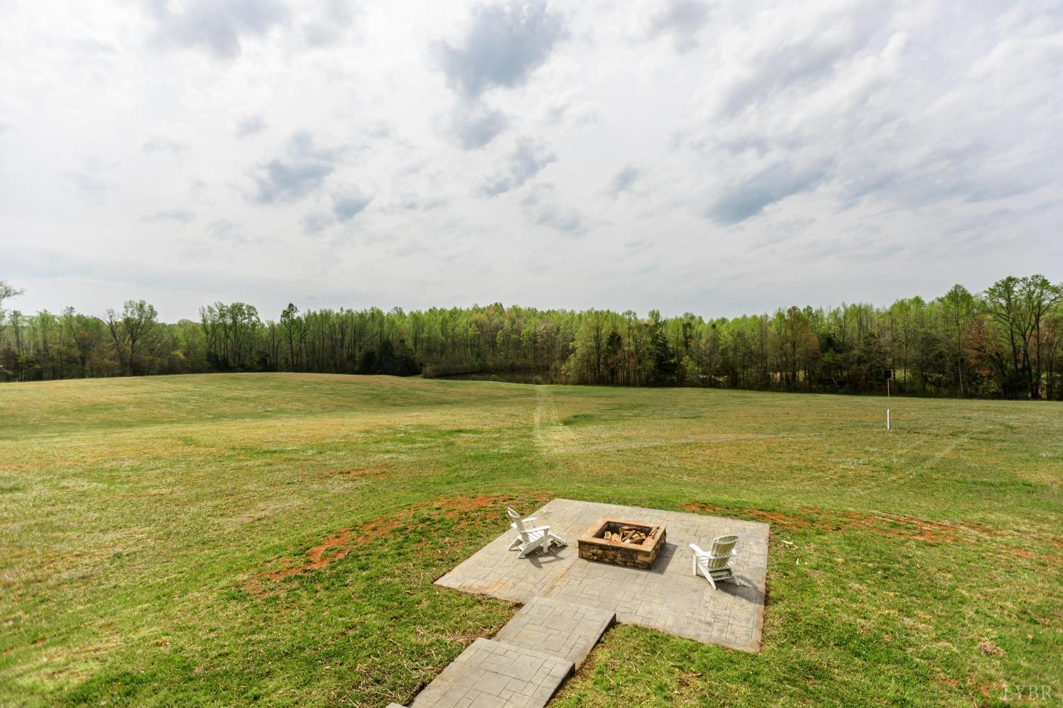 4037 County Line Road Cullen, VA 23934 - Photo 31 of 45 a view of a lake with couches in the back