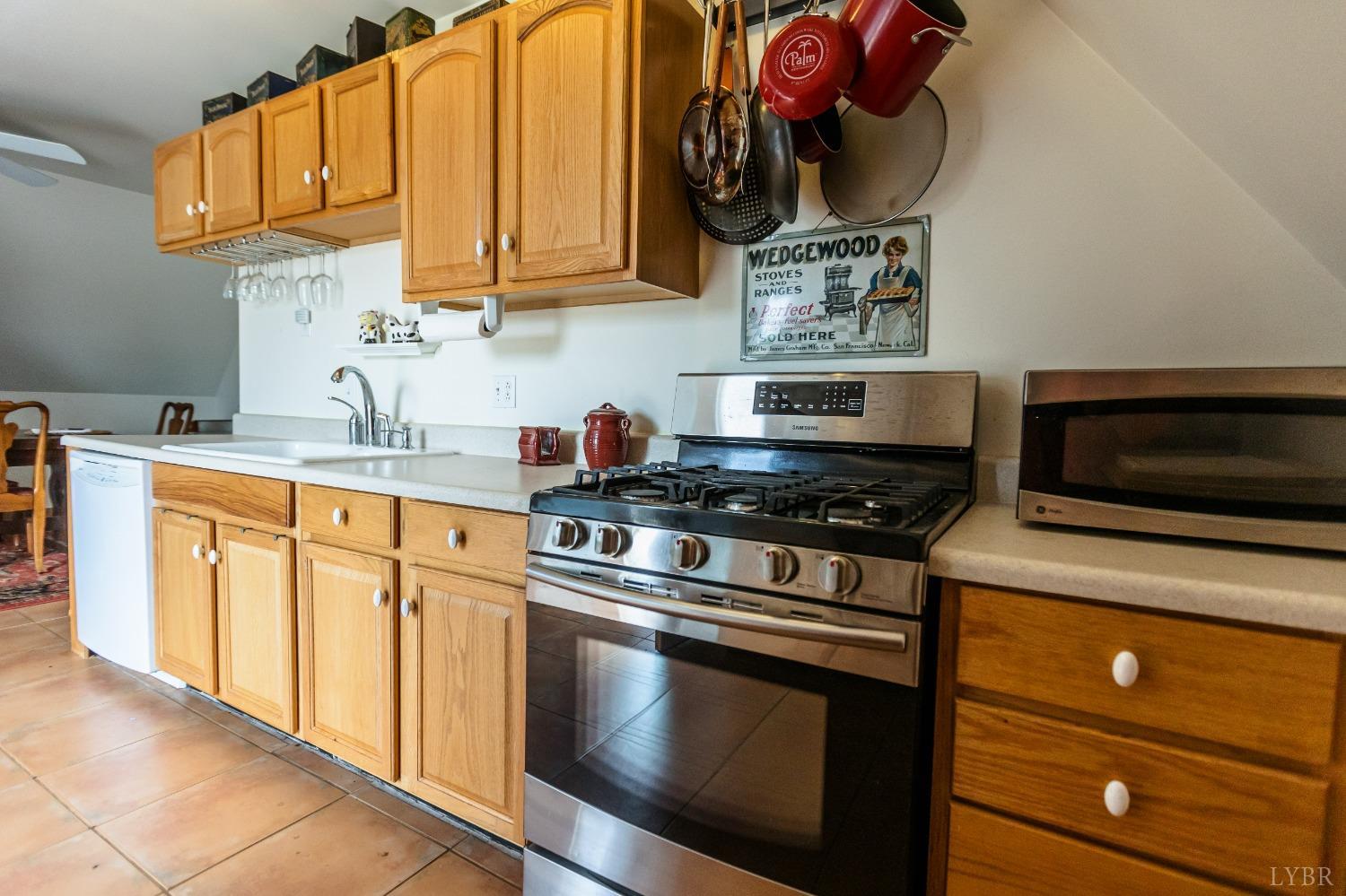 4037 County Line Road Cullen, VA 23934 - Photo 33 of 45 a kitchen with stainless steel appliances granite countertop a stove and a sink