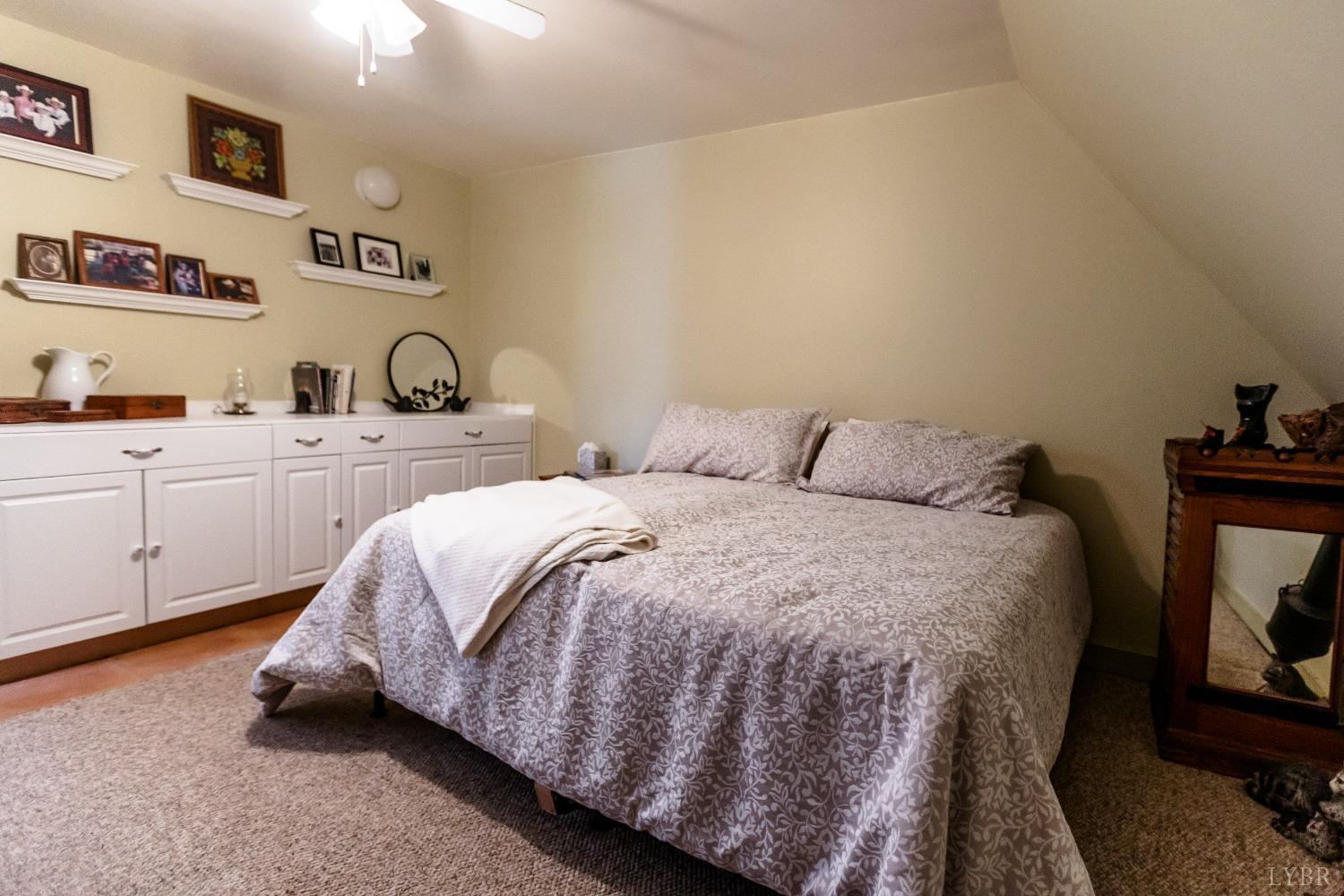4037 County Line Road Cullen, VA 23934 - Photo 37 of 45 a bedroom with a bed and cabinets