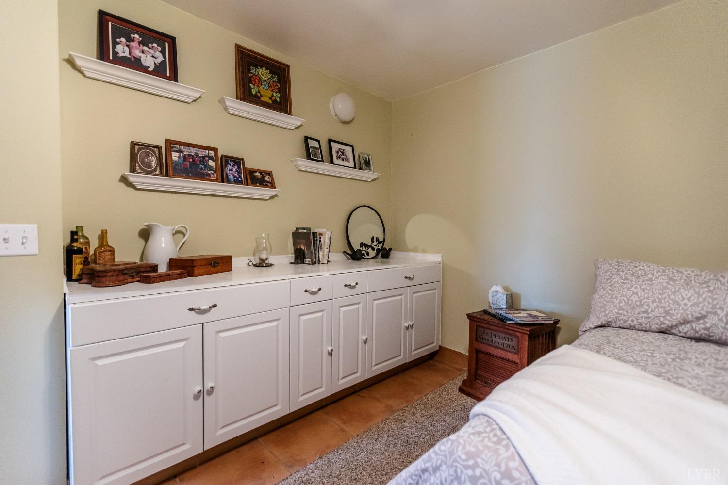 4037 County Line Road Cullen, VA 23934 - Photo 39 of 45 a bedroom with bed and cabinets