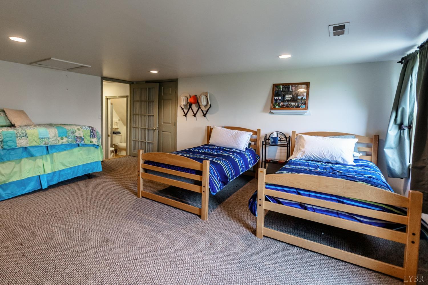 4037 County Line Road Cullen, VA 23934 - Photo 44 of 45 a bedroom with bed and a lamp on table
